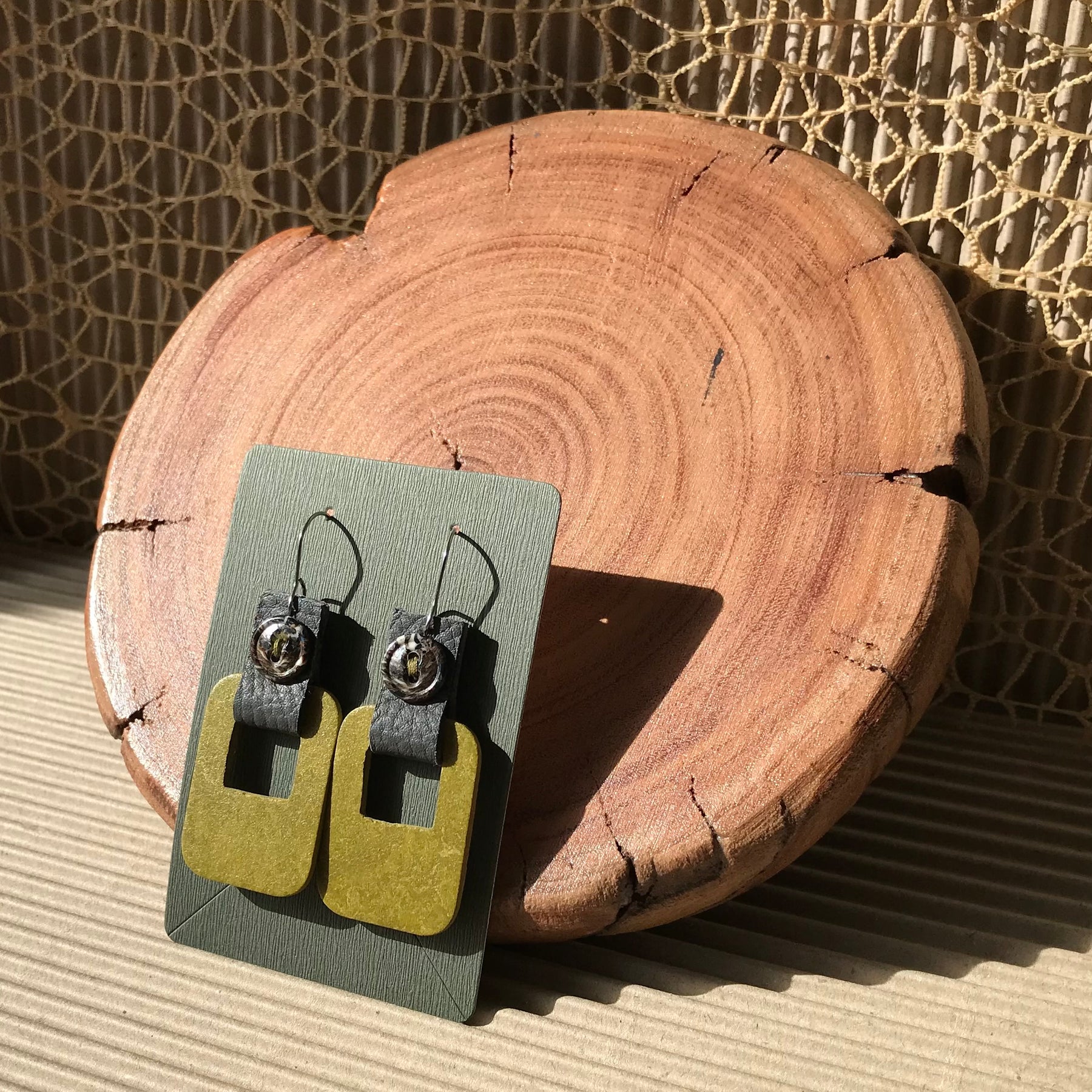 Handmade earrings made with flooring