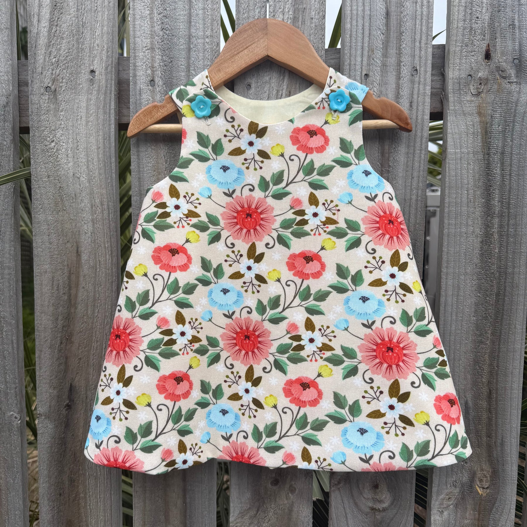 Girls Lotus flower pinafore ,size 2