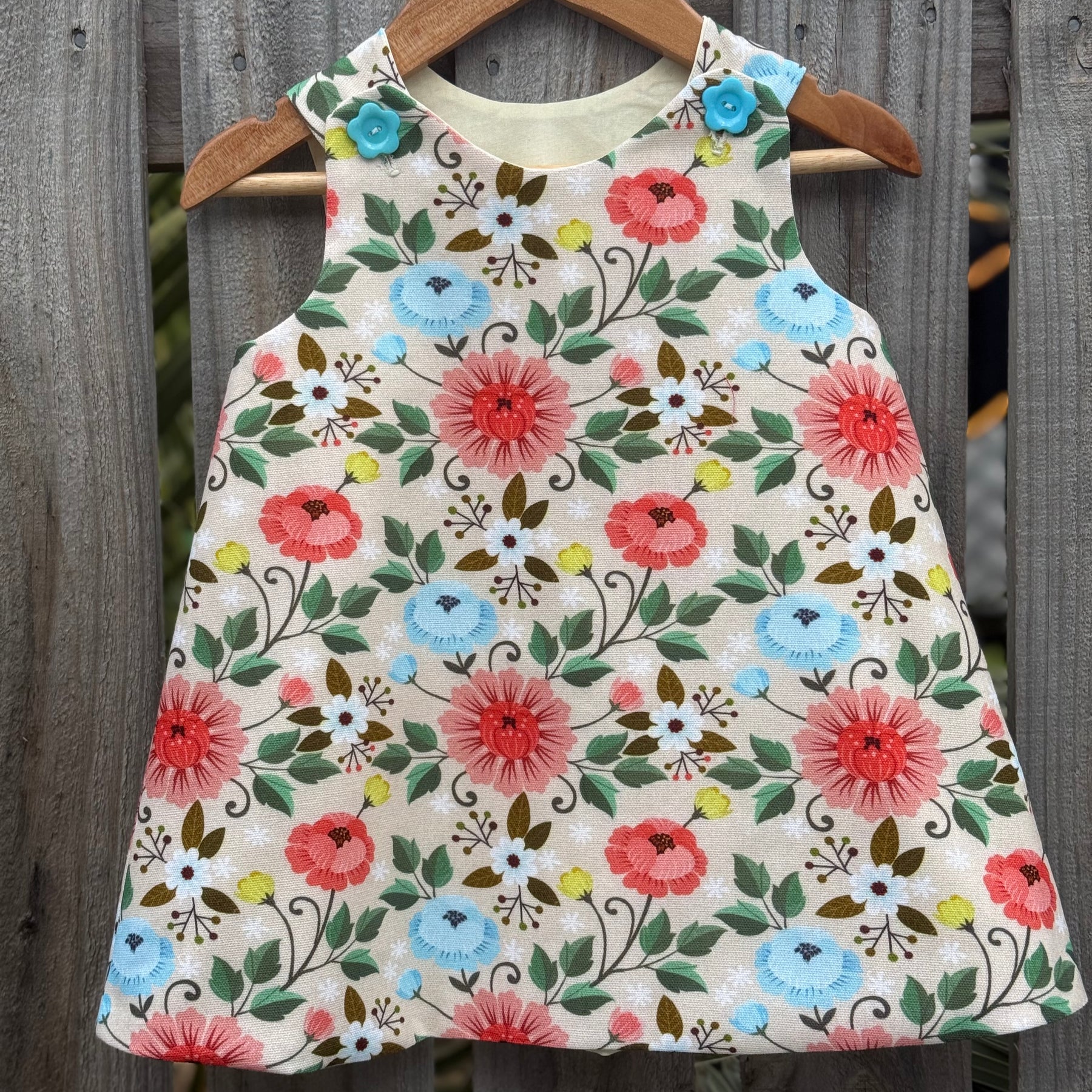 Girls Lotus flower pinafore ,size 2
