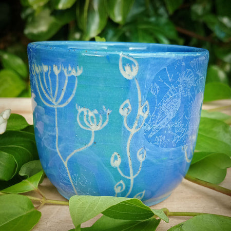 Blue botanical themed ceramic tumbler