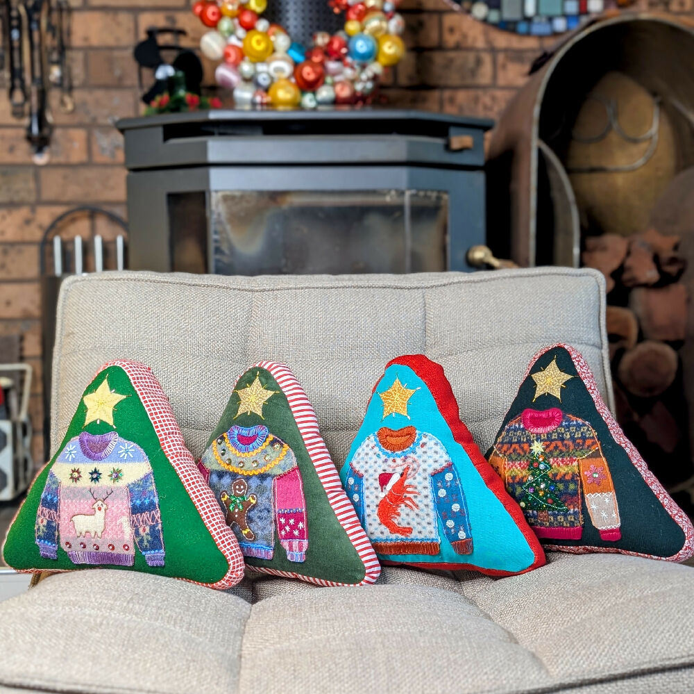 Xmas cushions in front of fireplace