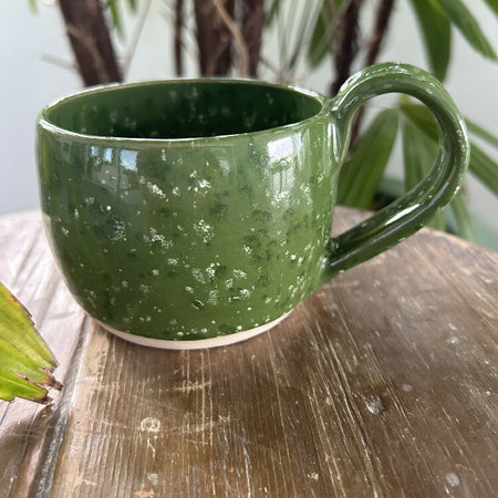 Green pottery mug