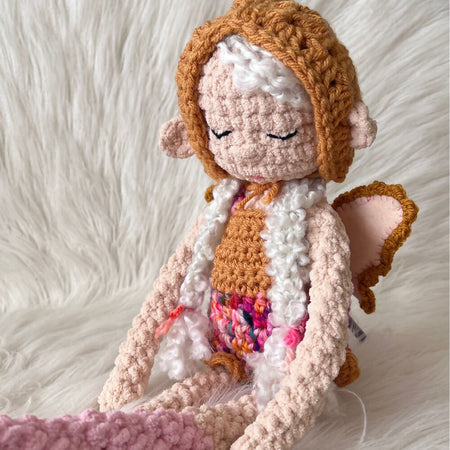 Crochet Fairy with romper and detachable wings.