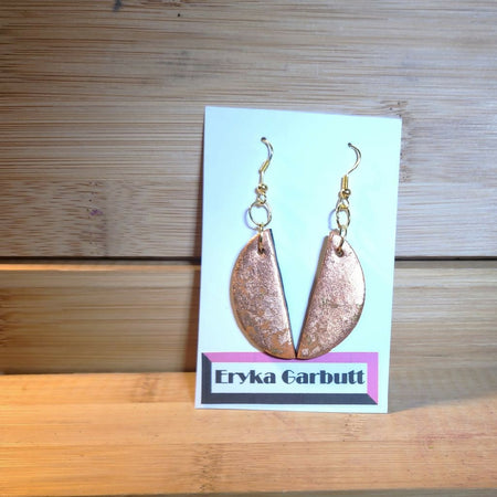 Dangle earrings. Orange and black polymer clay with gold leaf.