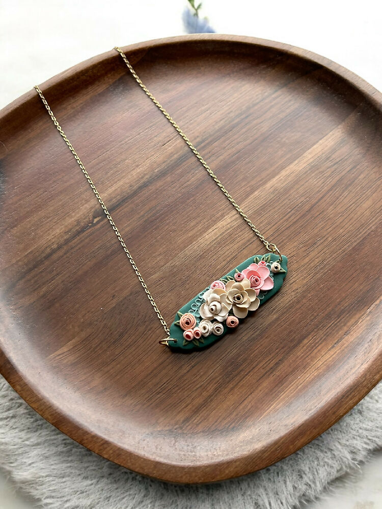 Green floral hand sculpted pendant necklace