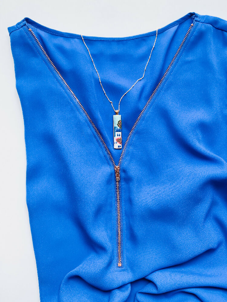 Santorini Hand Embroidered Necklace – Wearable Art Inspired by the Greek Islands - Styled with a blue top