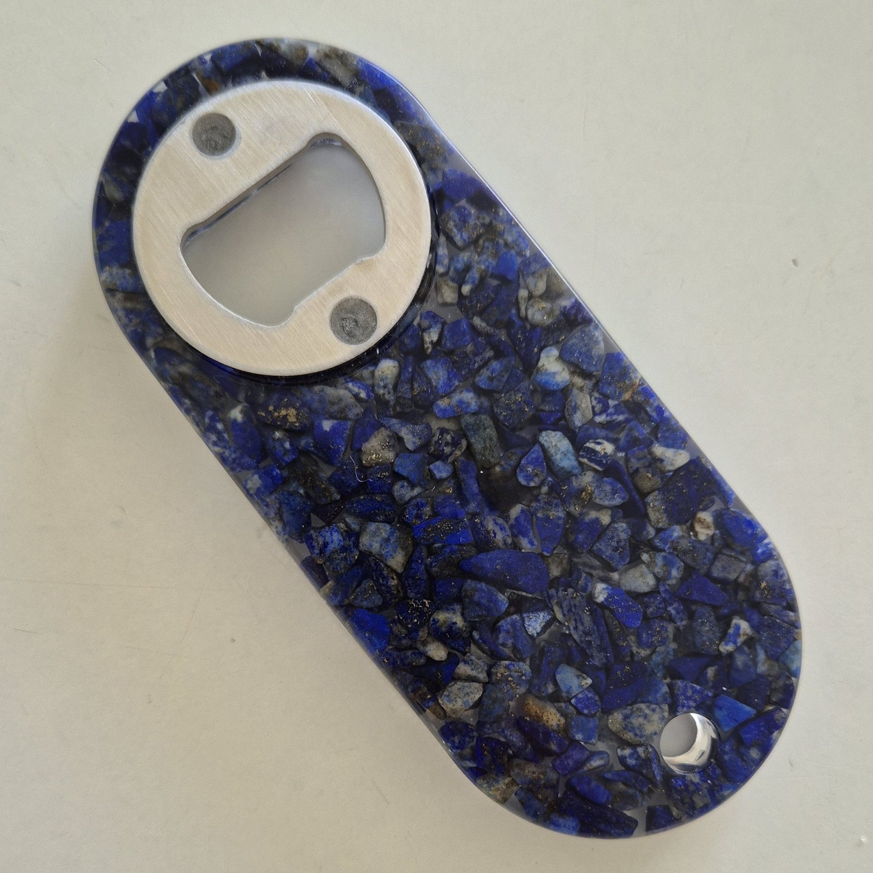 Resin bottle opener with inlaid semi-precious lapis lazuli