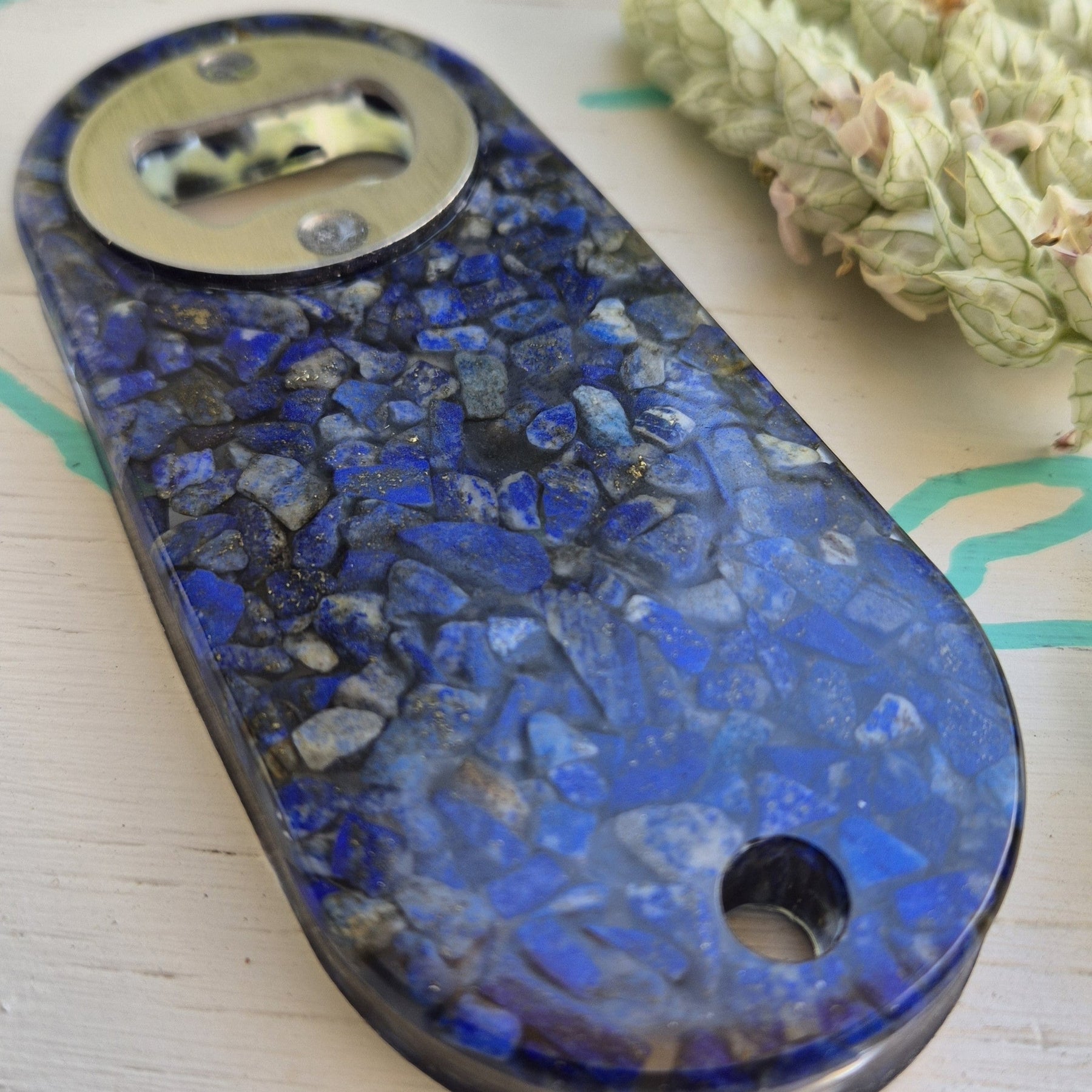 Resin bottle opener with inlaid semi-precious lapis lazuli