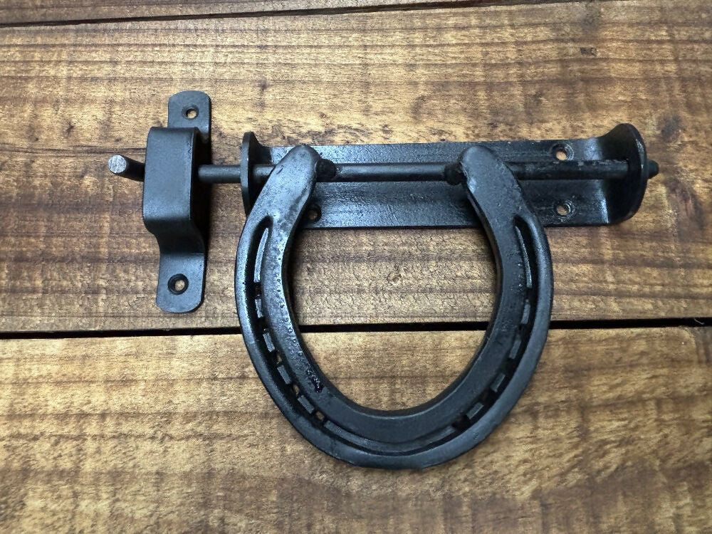Horse shoe door latch right together