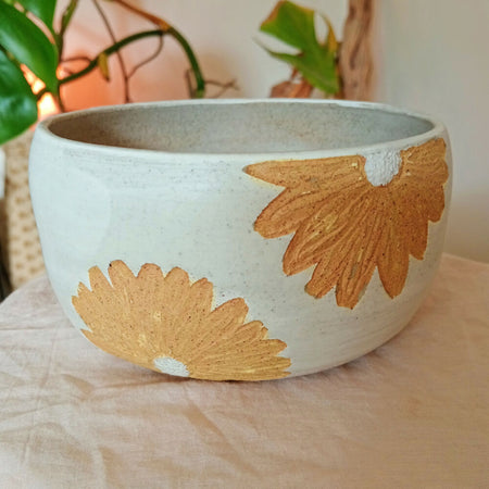 Ceramic breakfast bowl in speckled white with rustic yellow daisies