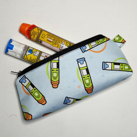 Epipen Pouch, light blue with a happy epipen print MINI scale print