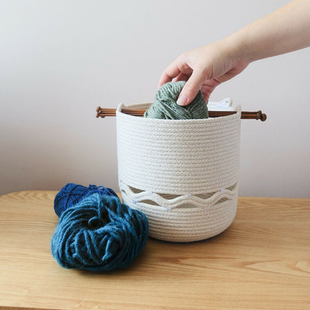 Yarn storage basket with knitting needle carry handle