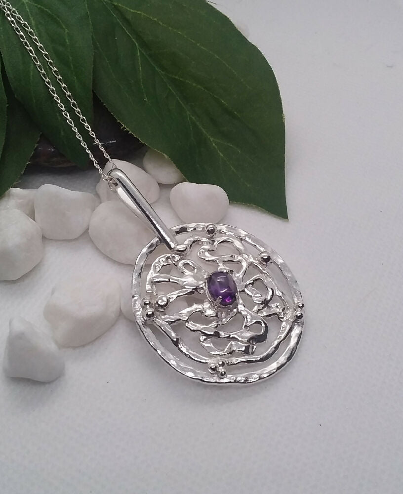 Sterling silver pendant with amethyst cabochon