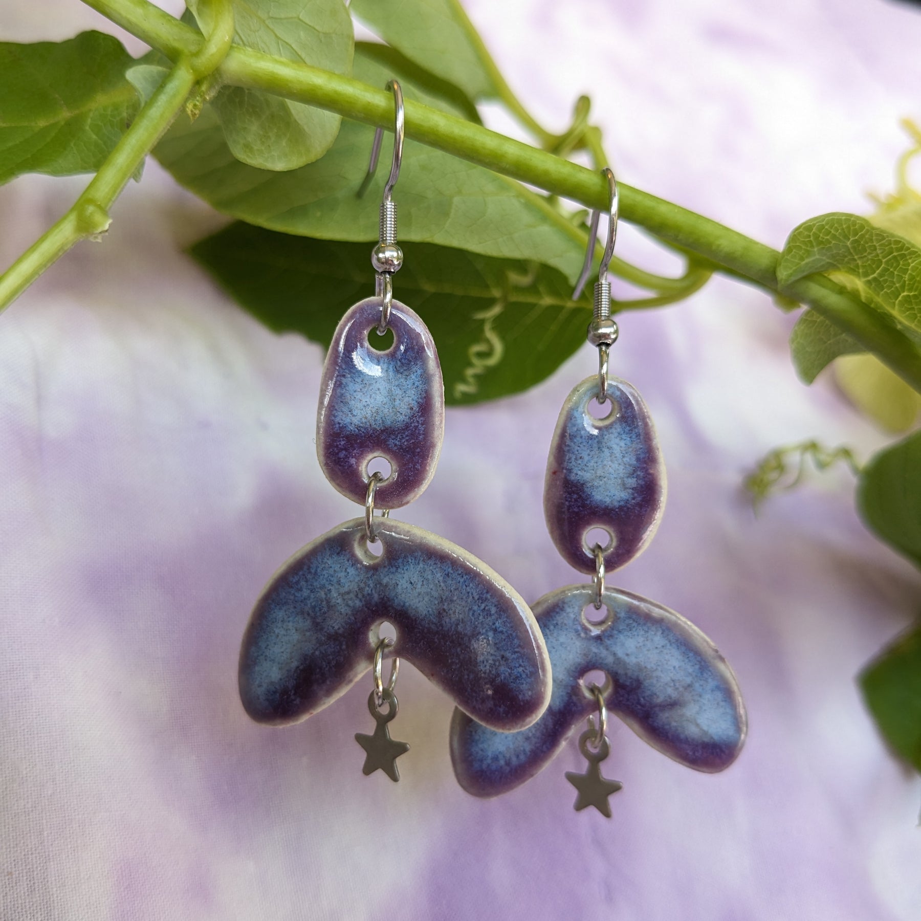 Purple Star, ceramic dangle earrings.
