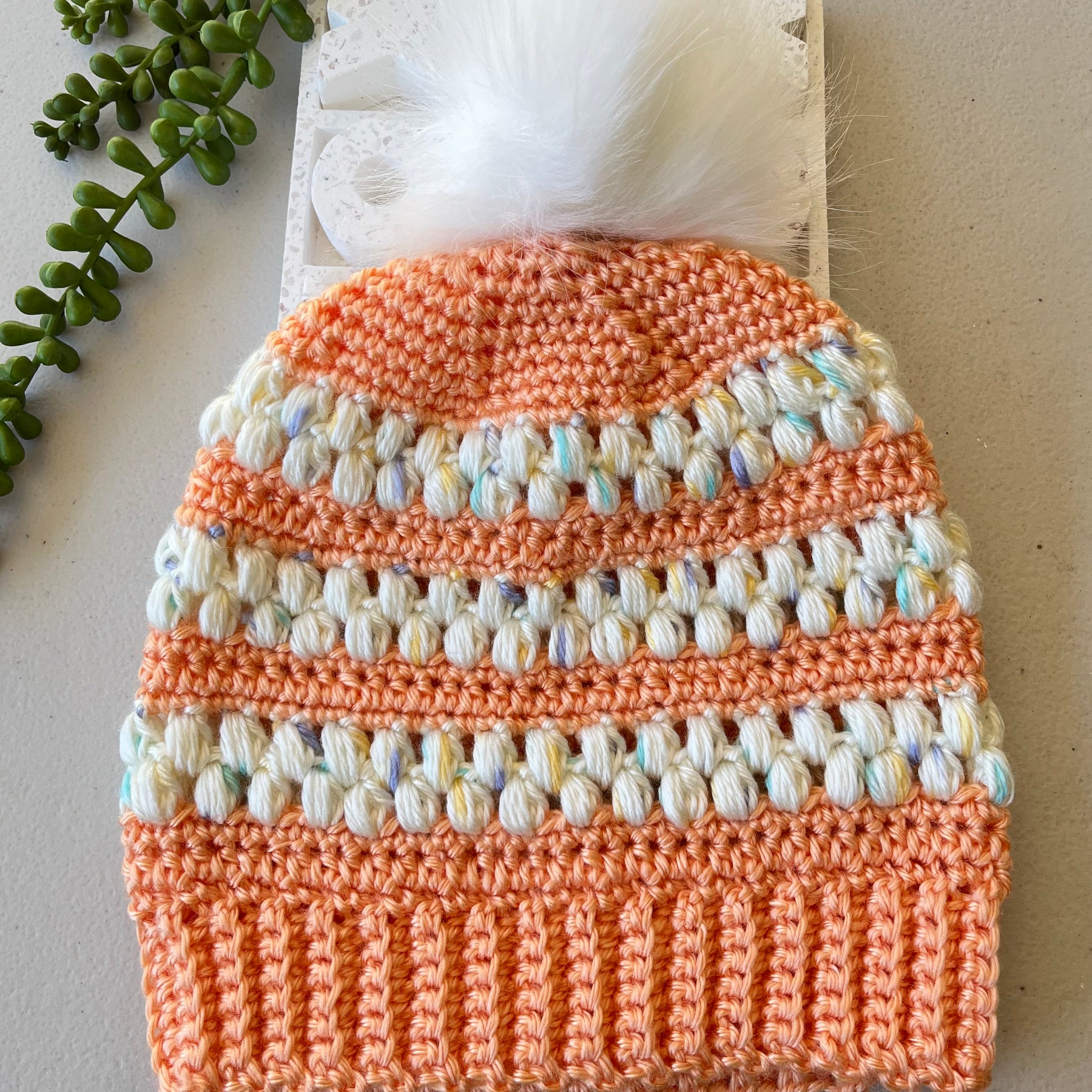 Children’s textured beanies with detachable pompom