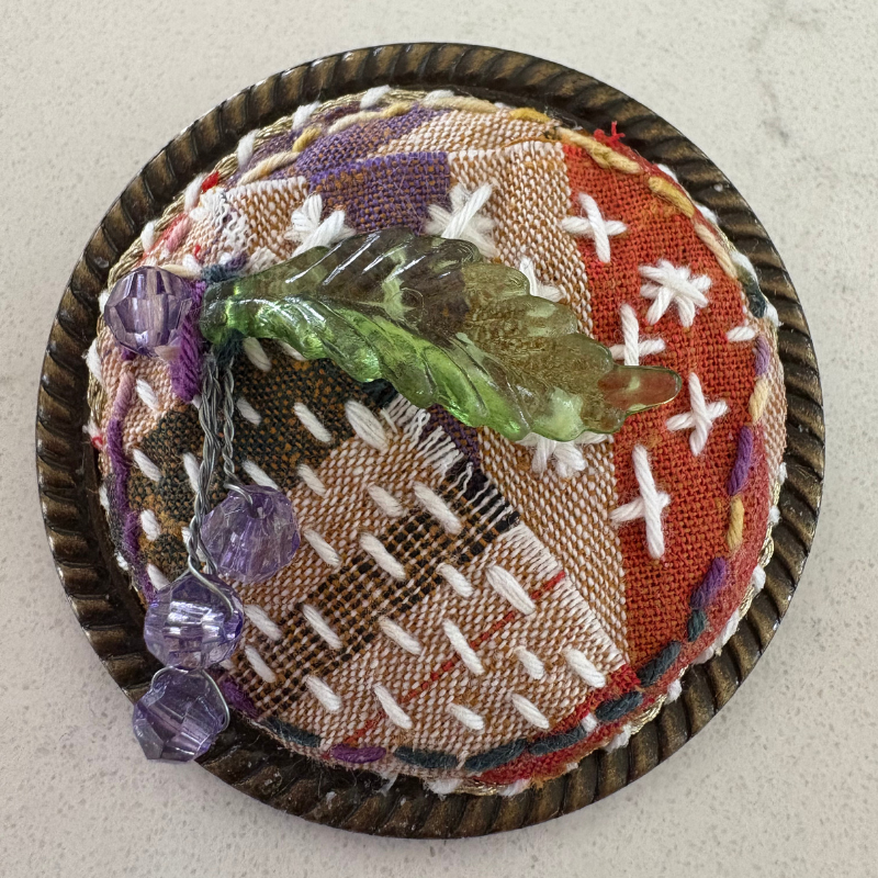 Boro inspired brooch in browns and greens