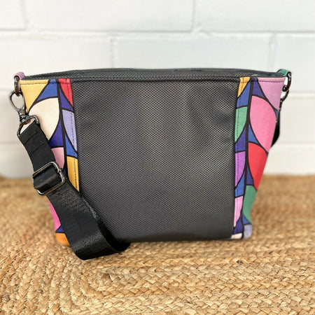 Black crossbody bag with colourful feature fabric sides