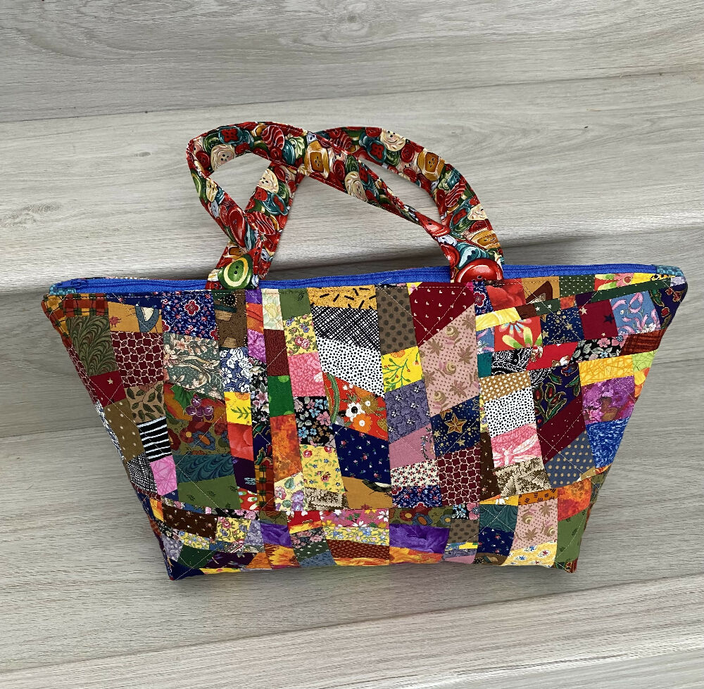 Extra wide opening patchwork handbag