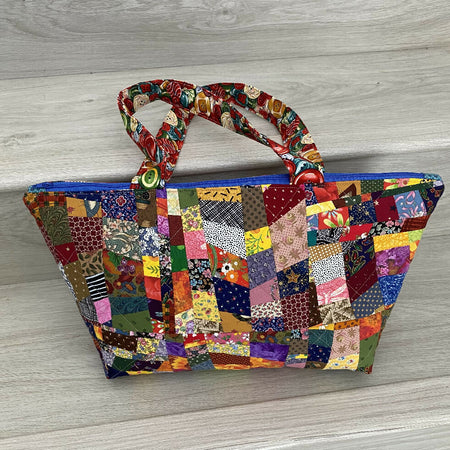 Extra wide opening patchwork handbag