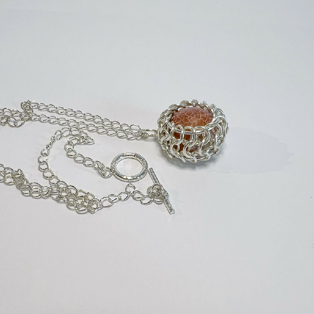 Caged fire agate pendant detail