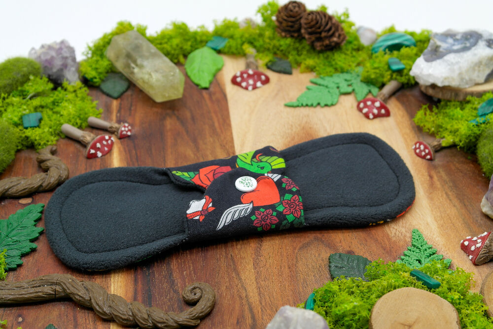 dig the flow reusables reusable cloth pad australian handmade red green mushrooms bamboo lycra black bird cotton unique one-of-a-kind flutter menstrual health business - waterproof softshell backer wing closure kam snaps