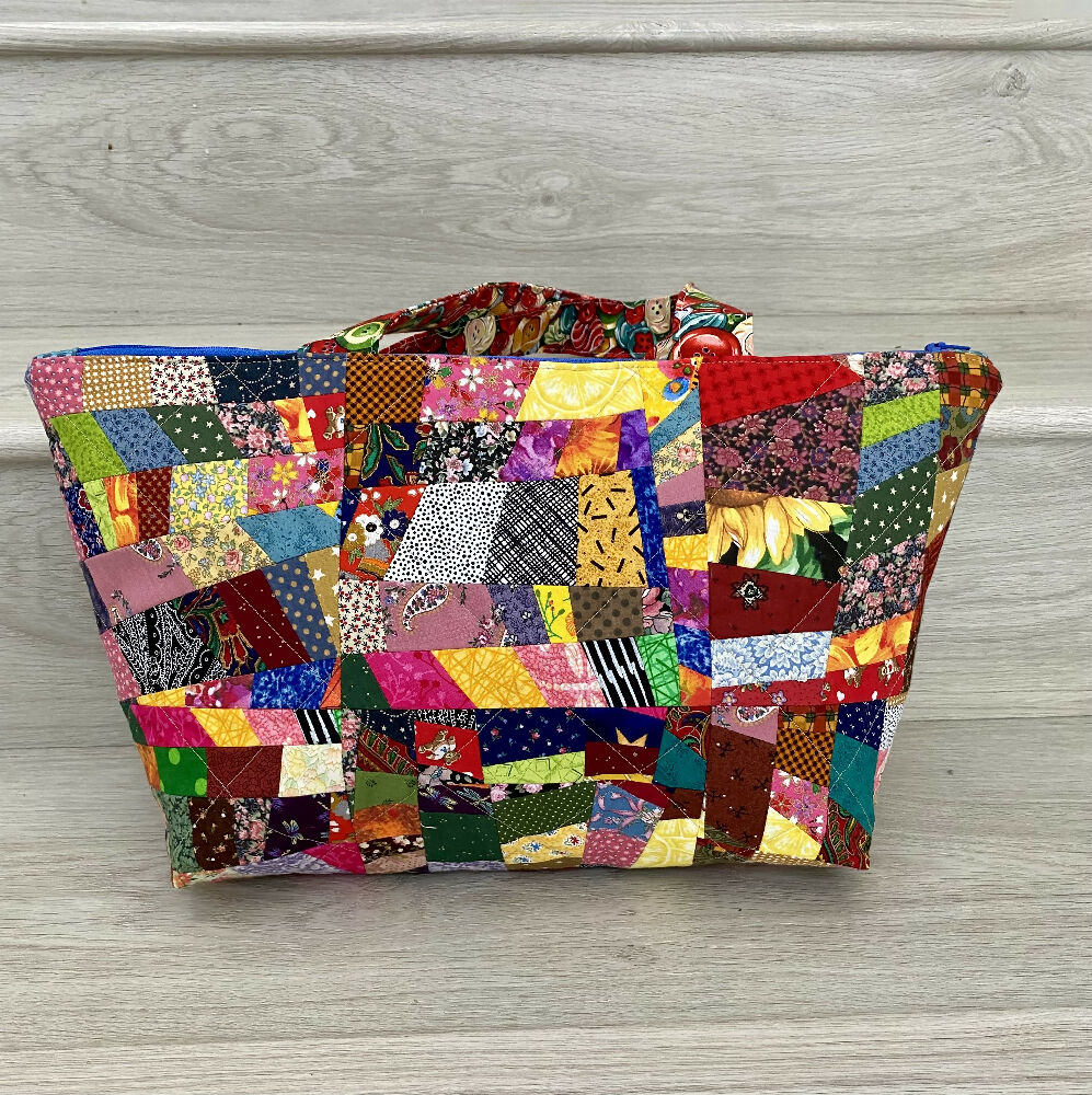 Extra wide opening patchwork handbag