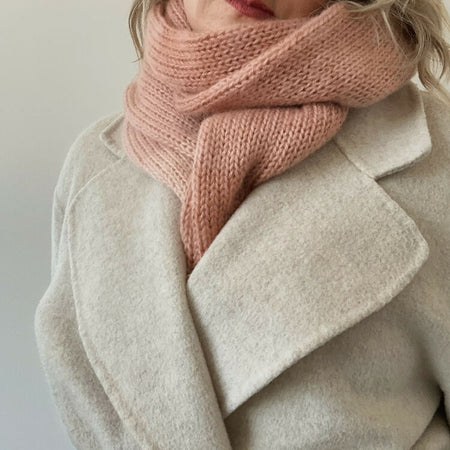 Soft and cozy knitted scarf in muted ombre shades