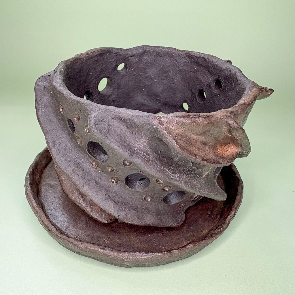 Ceramic orchid pot with twisting ridges