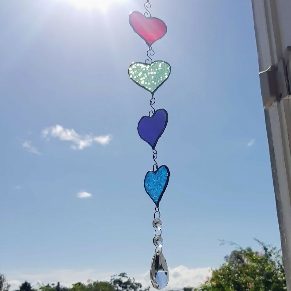 four colourful stained glass hanging hearts, hanging chain of hearts