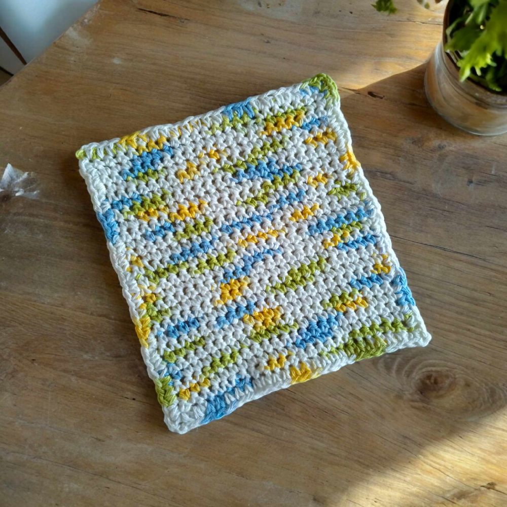 White Yellow Green Blue Dish Cloth on table top, 6.6.2024