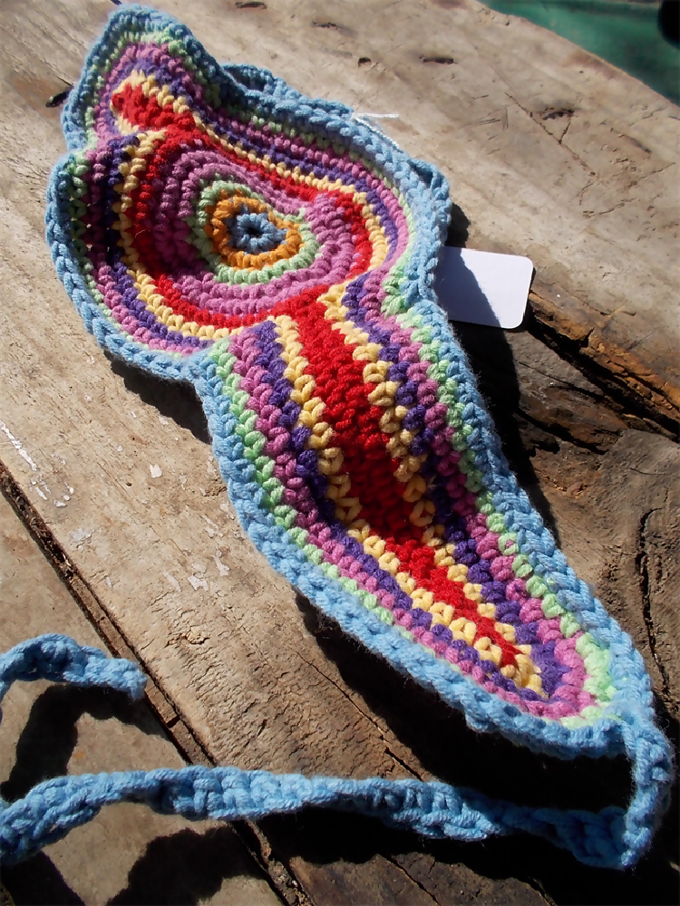 Crocheted headband in rainbow colours