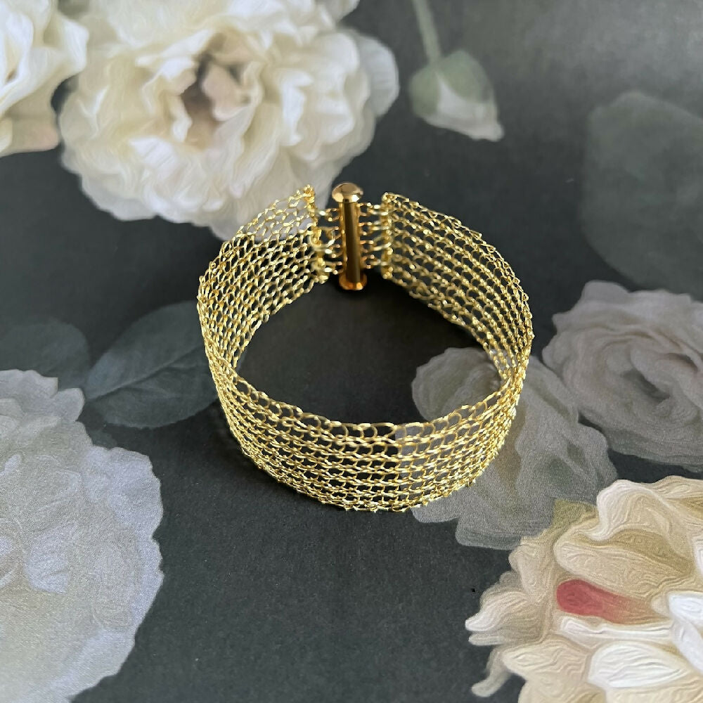 Knitted gold colour bracelet
