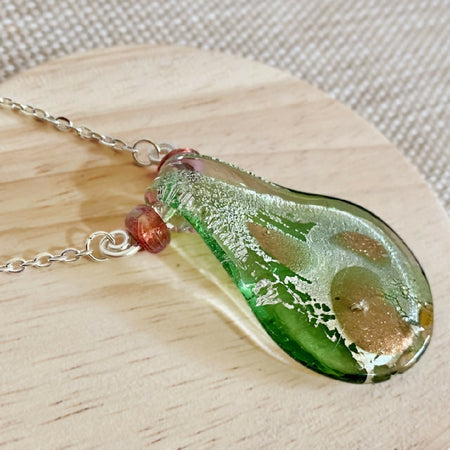 Green glass lampwork pendant on silver chain