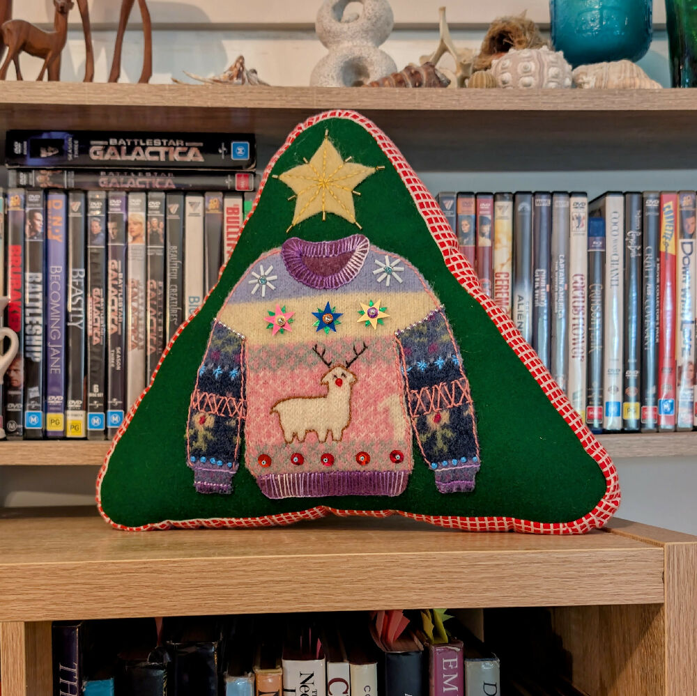 Rudolph Llama cushion on shelf