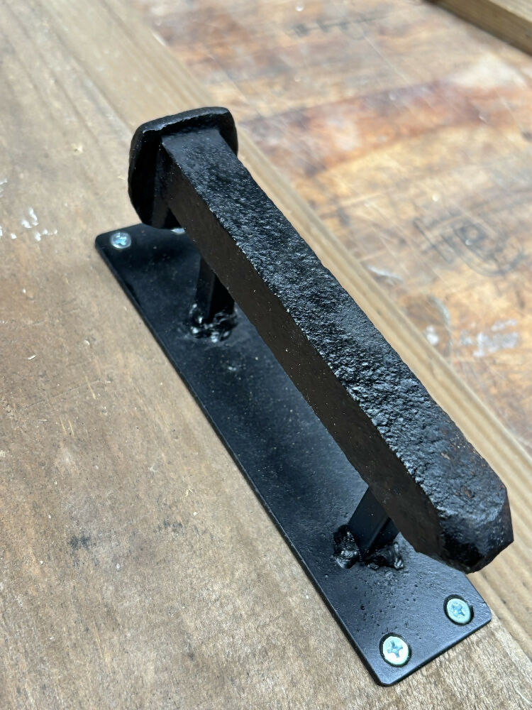 Railway spike door handle