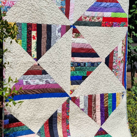 Scrappy Geometric designed single bed quilt