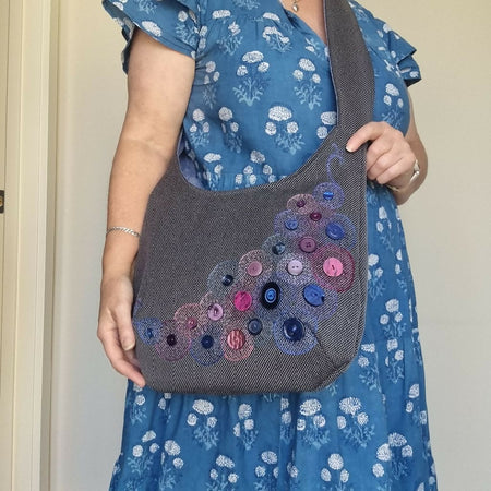 Upcycled hand-embroidered hobo bag with feature buttons