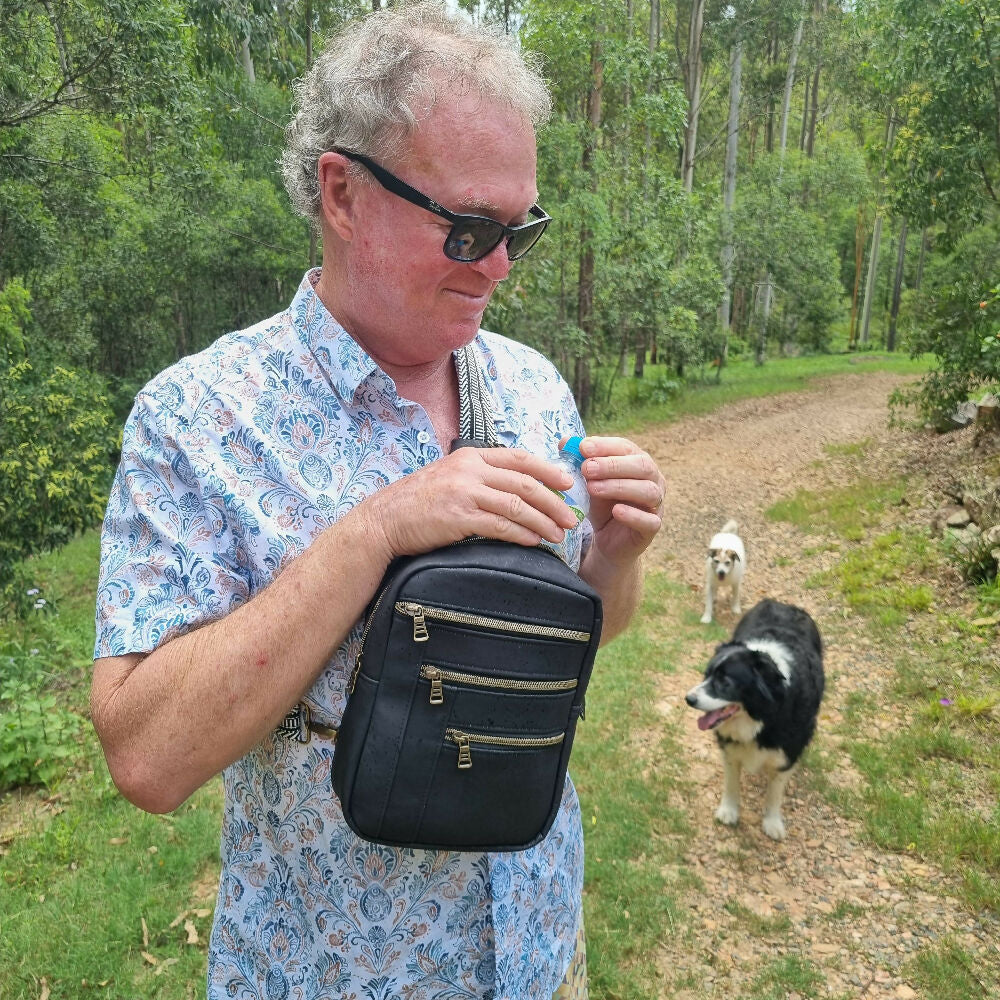 black-cork-sling-bag being worn