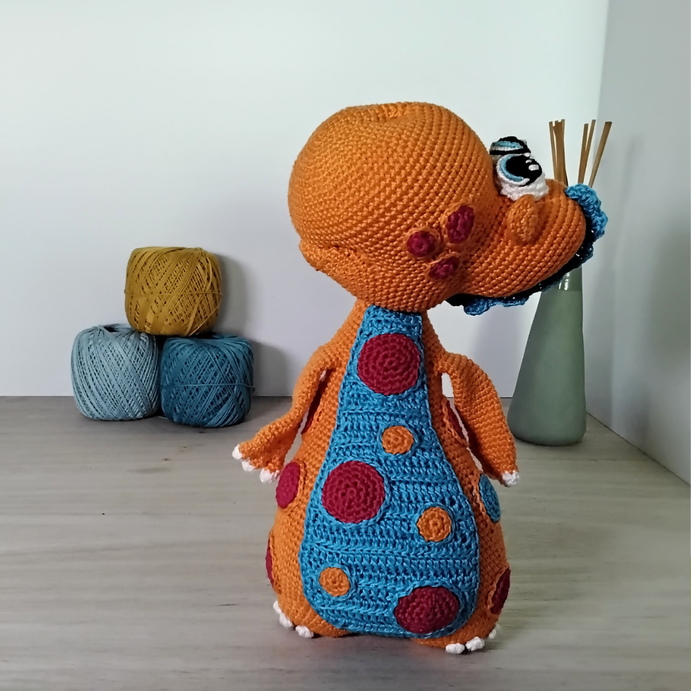 Orange-dinosaur-looking-sideways-Australian-made-watch-the-birdy-crochet