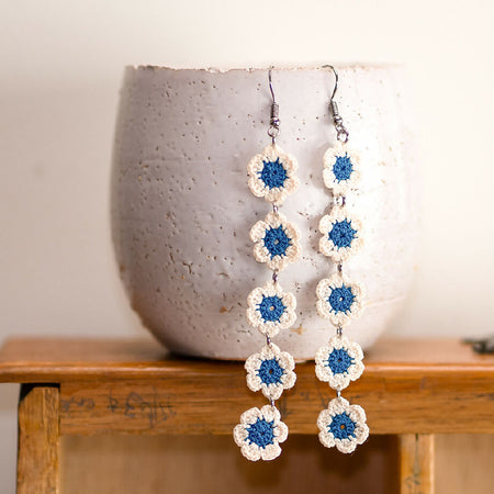 Long string of daises micro-crochet earrings - dark peacock blue and ivory