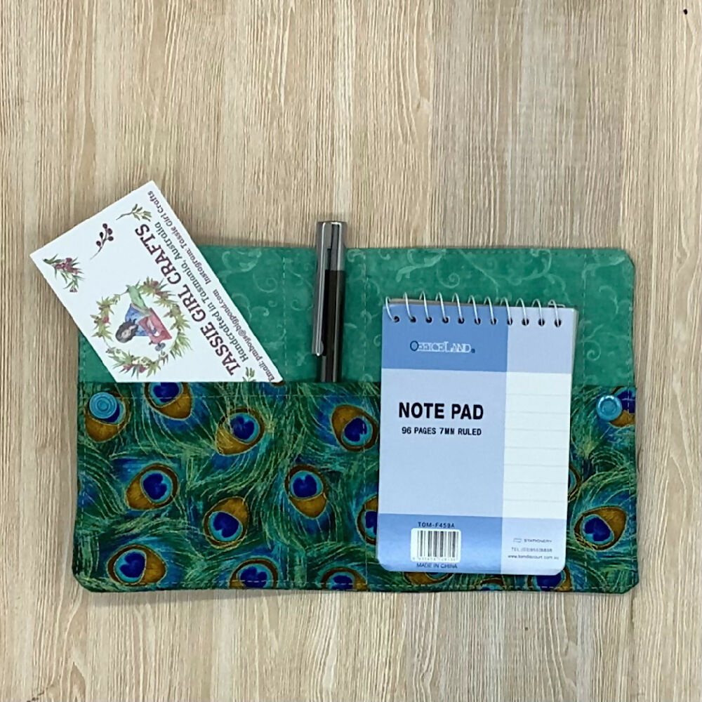 Peacock feathers refillable fabric pocket notepad cover with snap closure. Incl. book and pen.