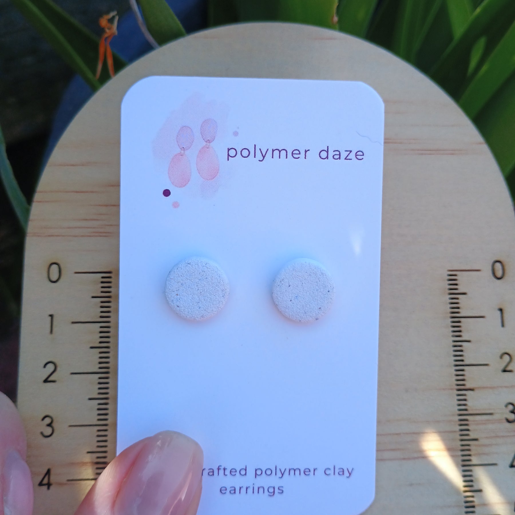White sandy stud earrings