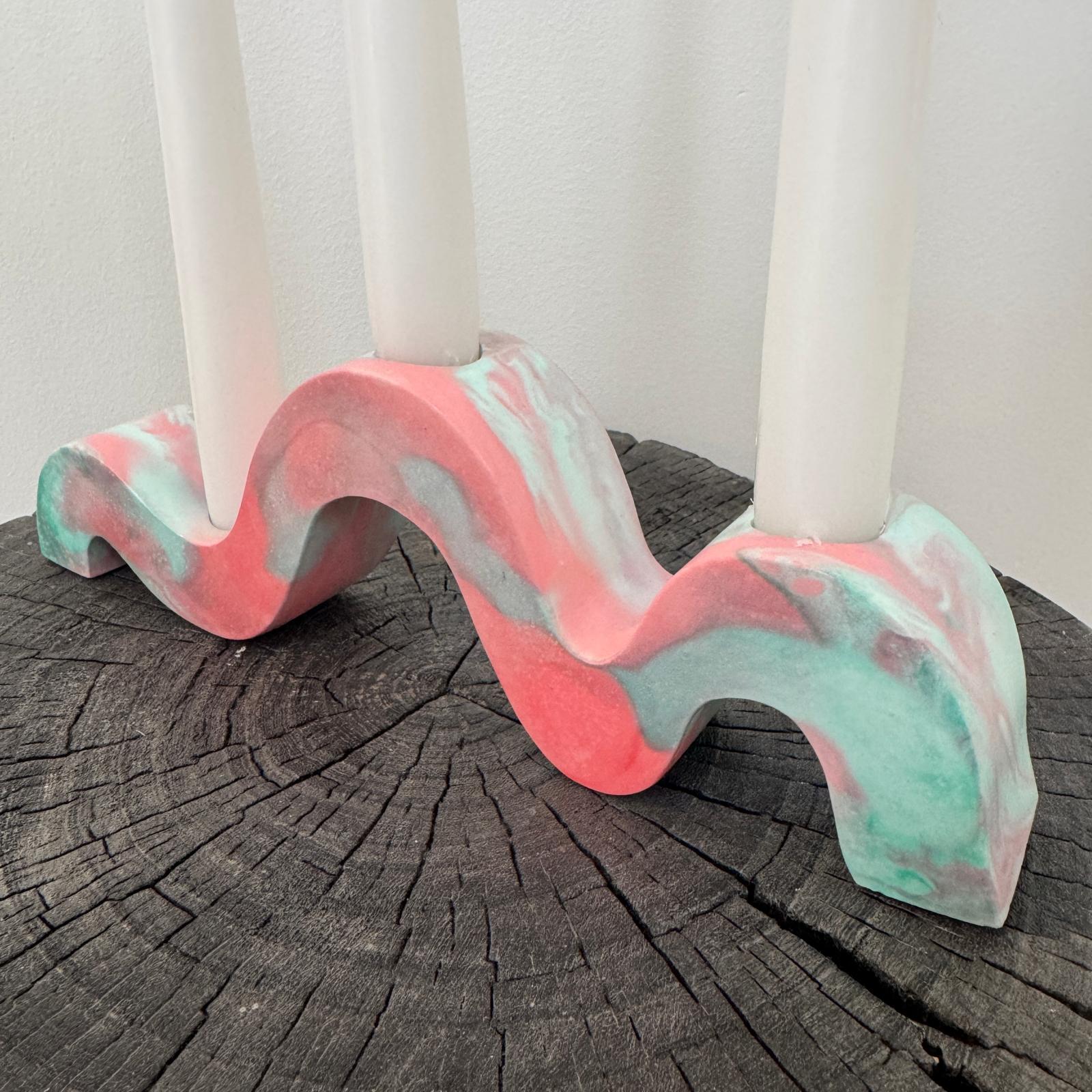 Red and green and gold wavy concrete holder for taper candles