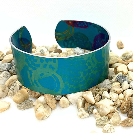 Printed and dyed green anodised aluminium bangle