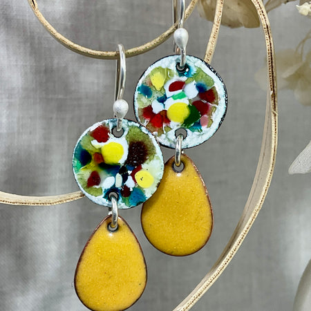 Mustard tear drop with abstract disc. Enamel. Handmade