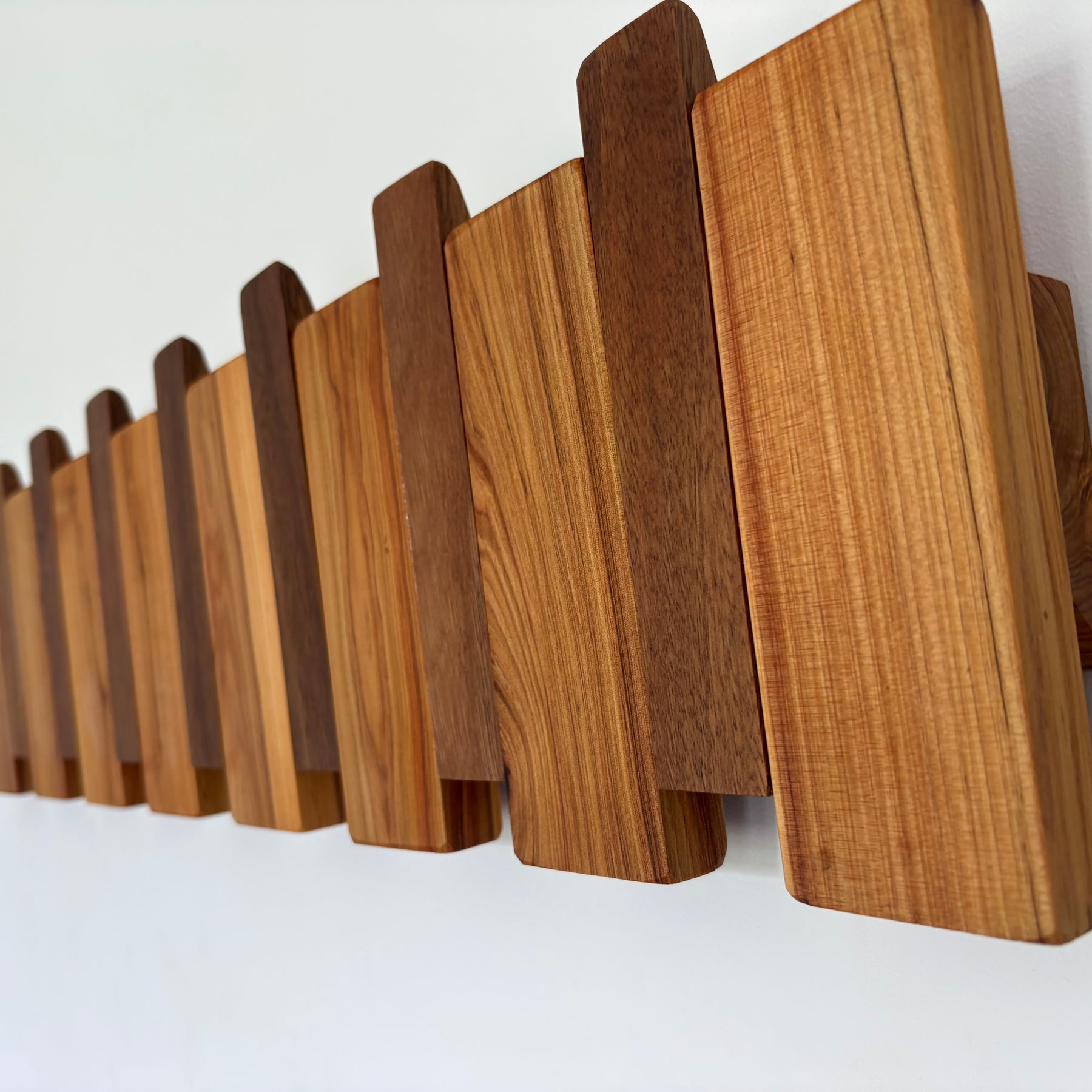 Two tone piano style coatrack