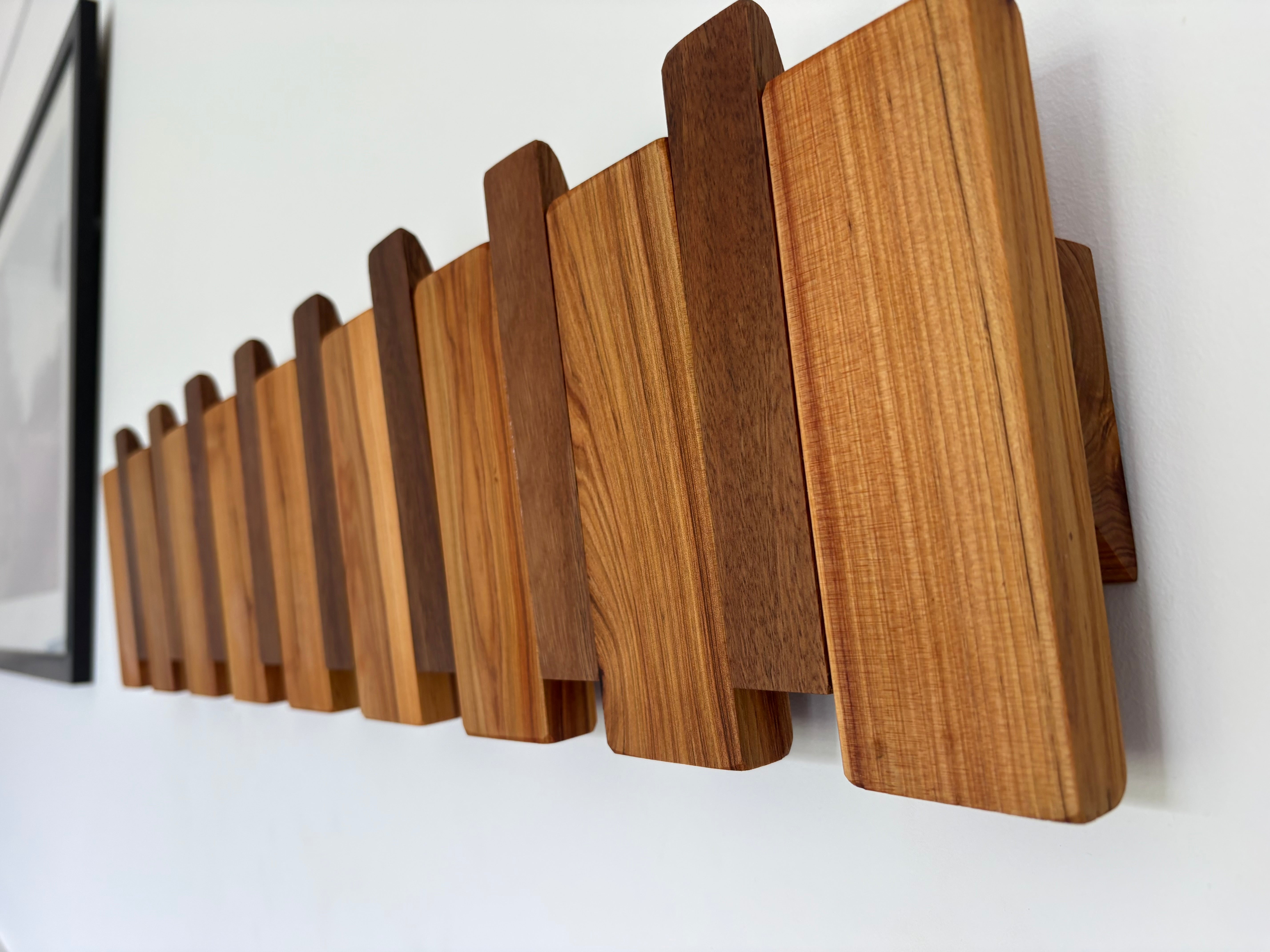 Two tone piano style coatrack