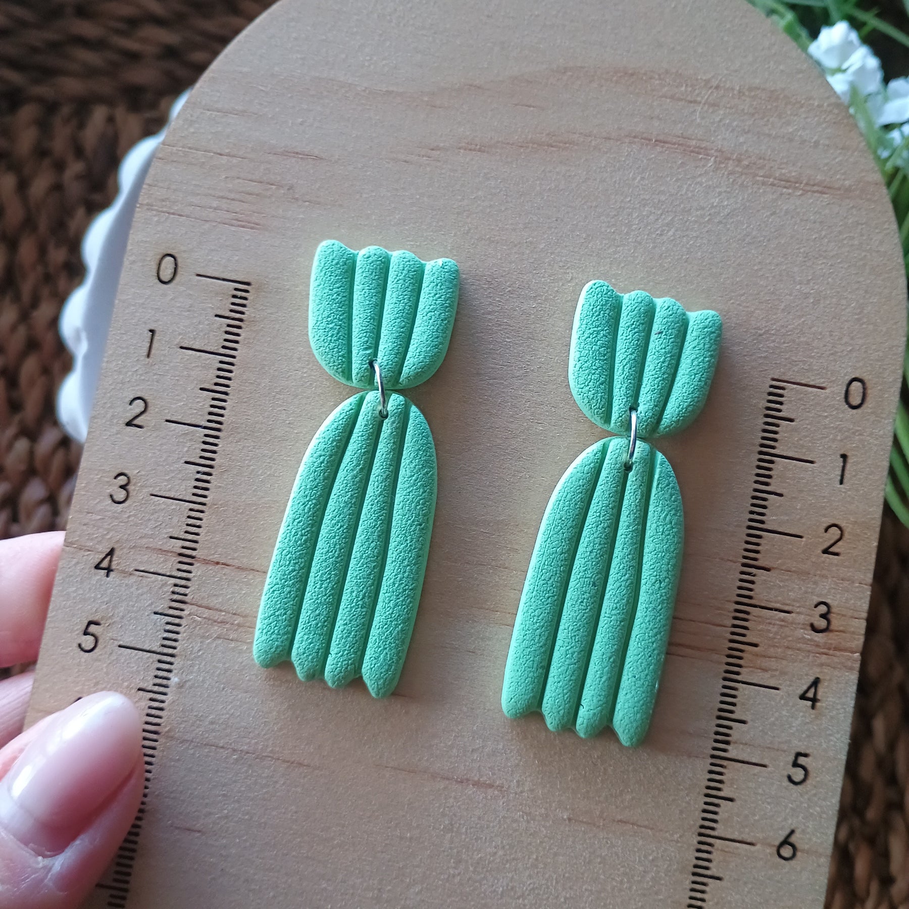 Embossed petal dangle earrings