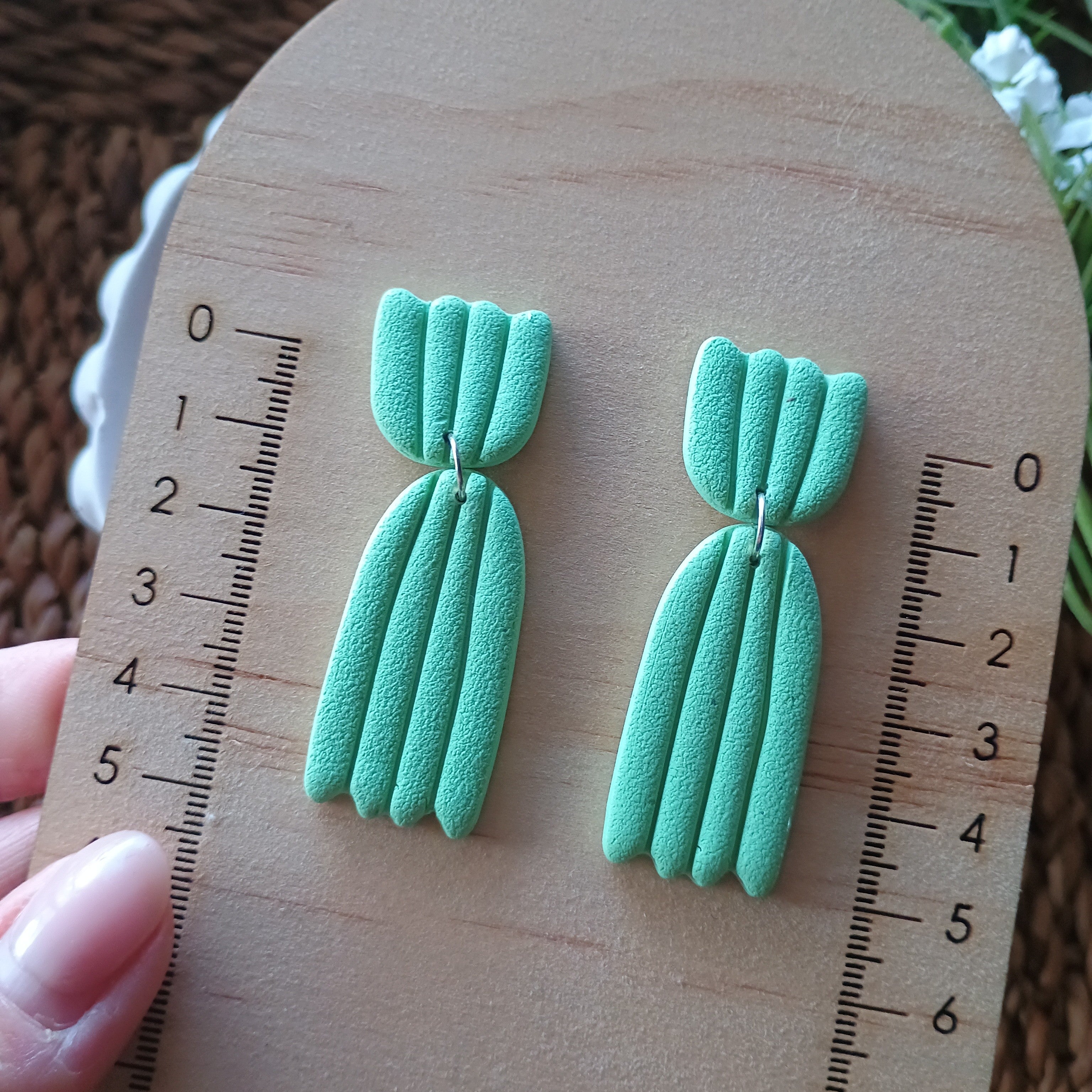 Embossed petal dangle earrings