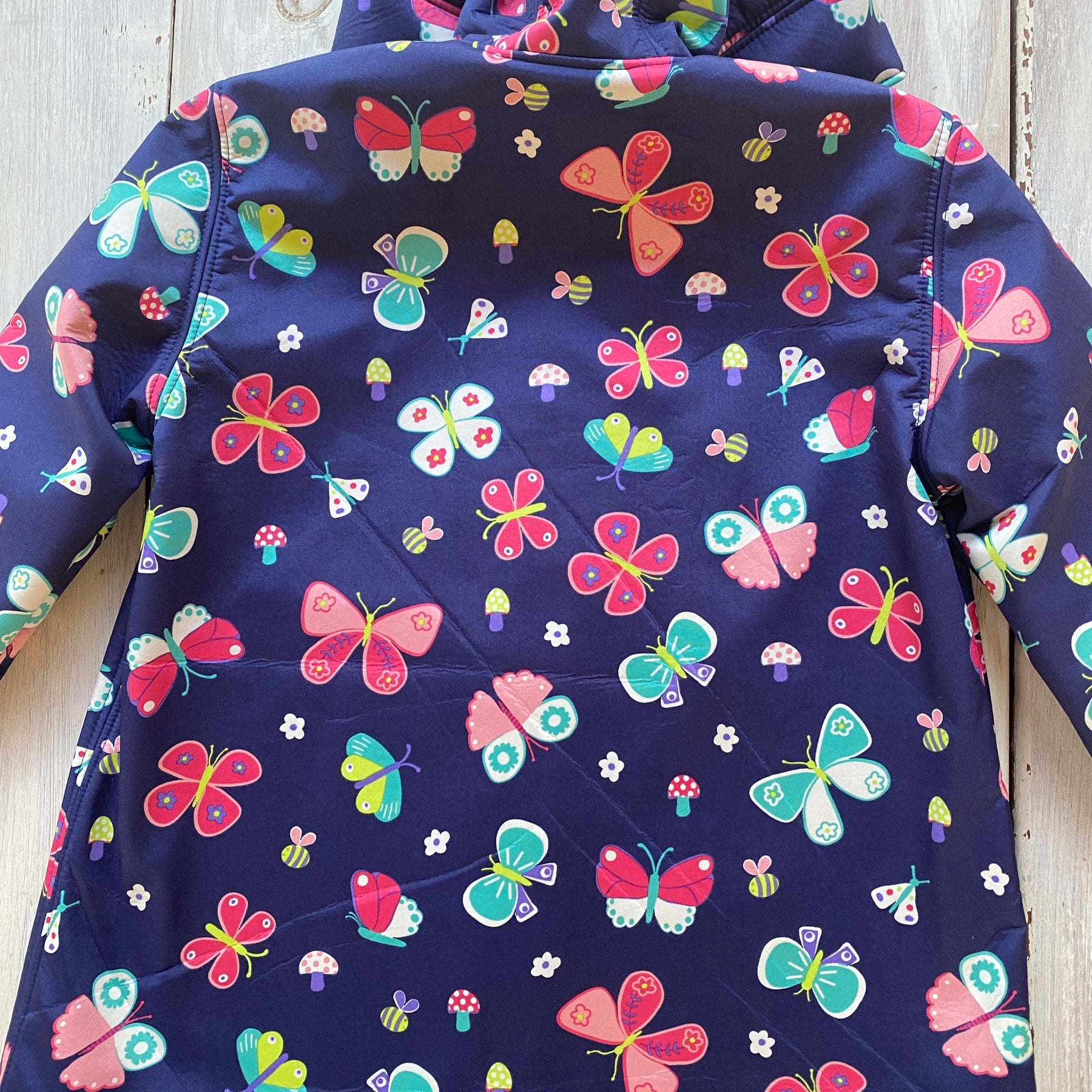Showerproof Butterflies on Blue Hooded Jacket size 5